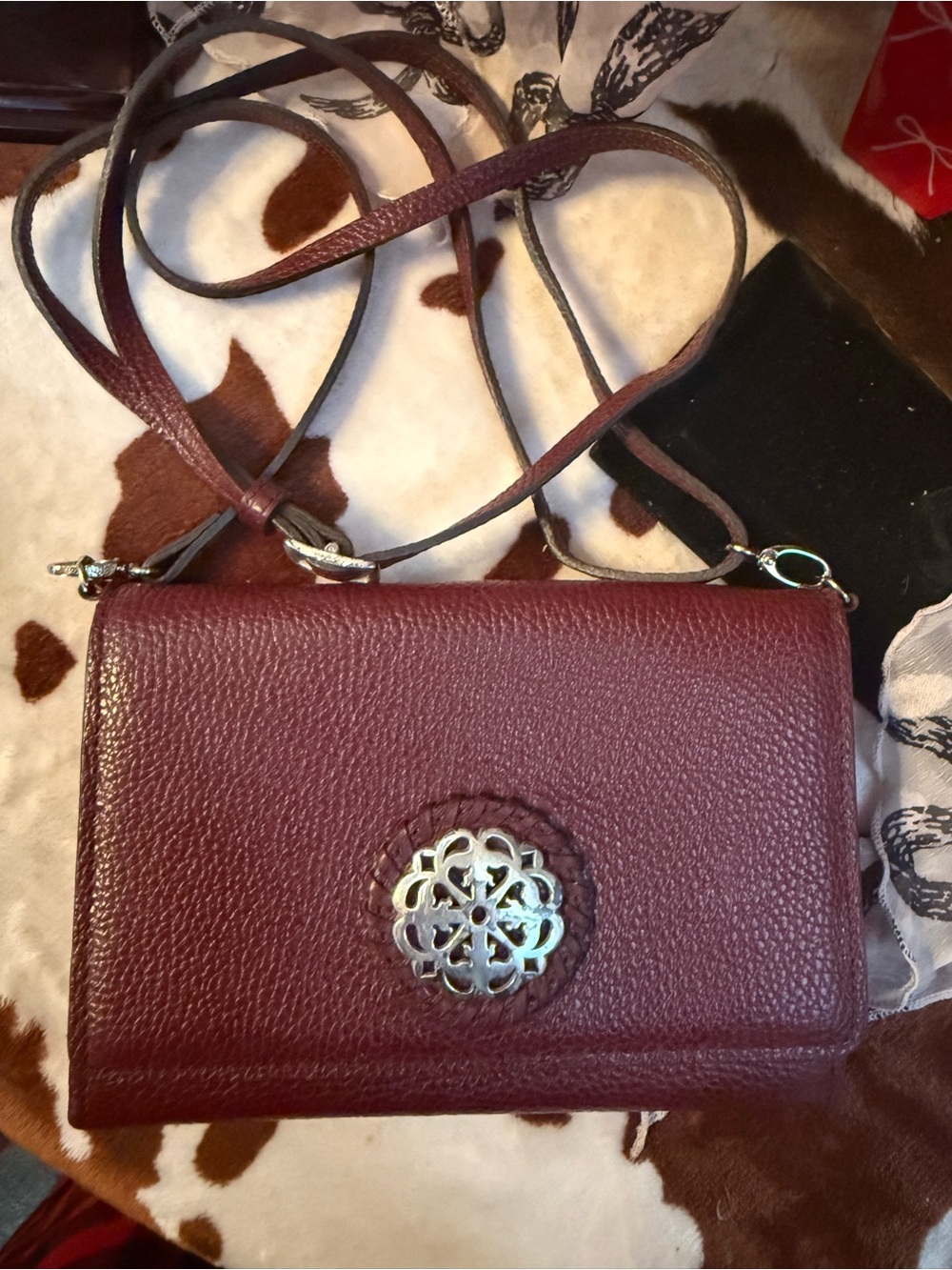 Pebbled Burgundy Crossbody with Decorative Silver Medallion